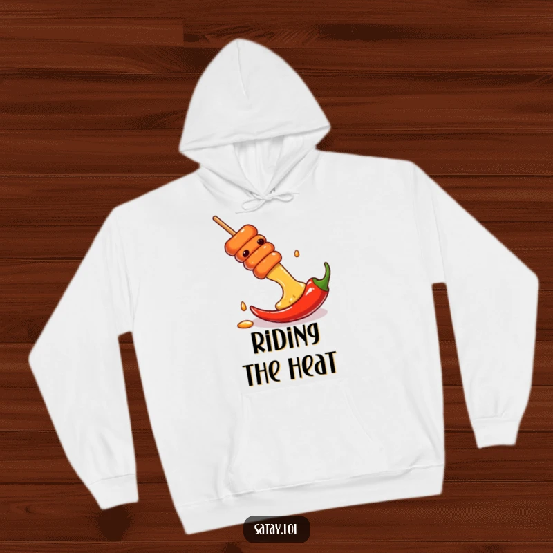 Funny hoodie illustrating a satay skewer gracefully sliding down a chili pepper, offering cozy and spicy vibes.
