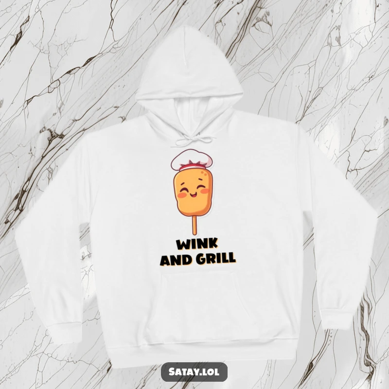 Funny cozy hoodie with a satay skewer character wearing a tiny chef hat and winking confidently.