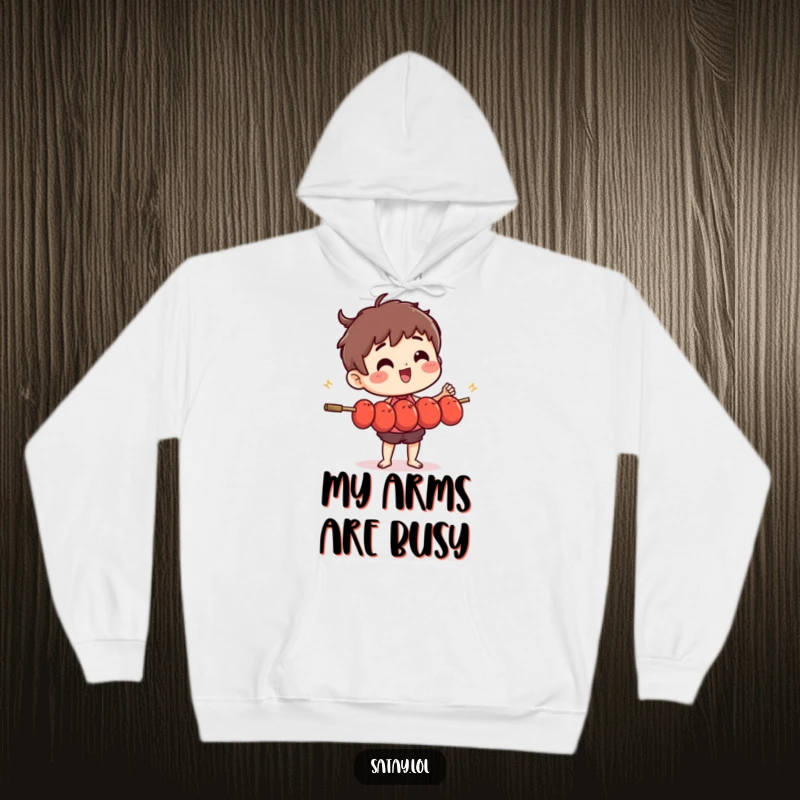 Funny satay skewer character with a determined look, juggling many small, wiggly meatballs on a hooded sweatshirt.