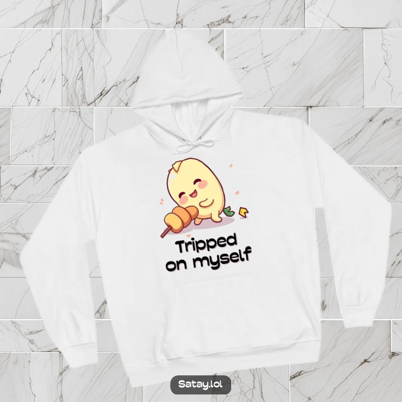 Funny cozy hoodie with a satay skewer character hilariously tripping over its own stick, embracing clumsiness.
