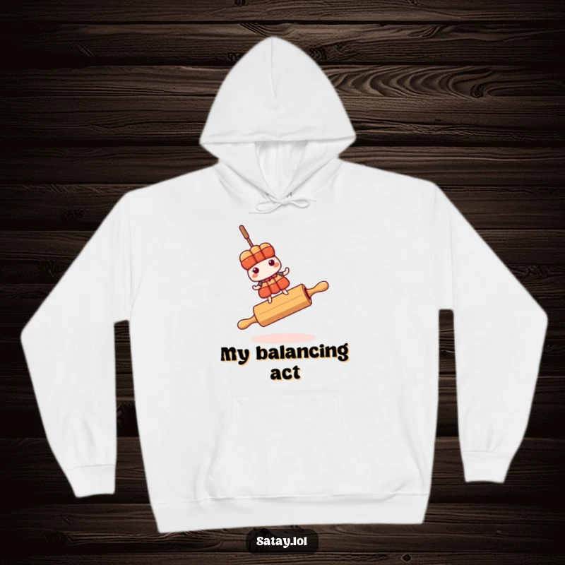 Funny satay skewer character precariously balancing on a rolling pin, featured on a comfortable hoodie.