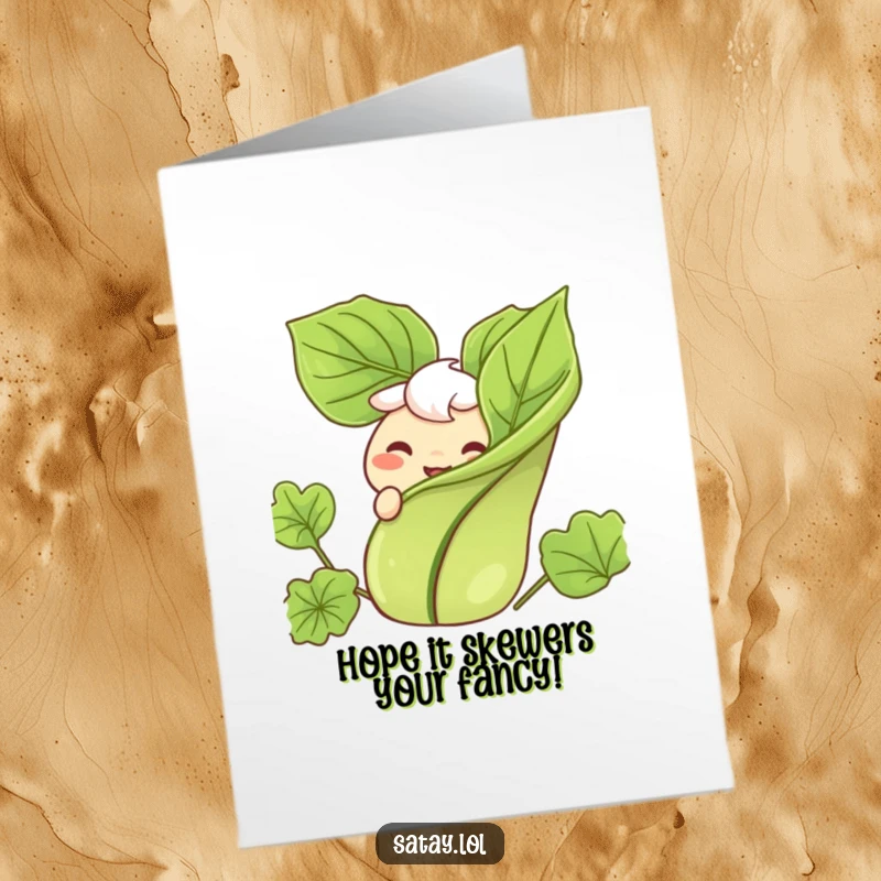 Funny Free Printable Satay Birthday Card: A satay skewer peeking from behind a leaf with a wide, happy grin.