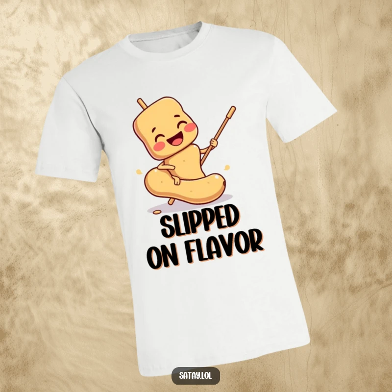 Funny Satay Skewer T-Shirt: A smiling skewer comically slips on a peanut, a funny and relatable food moment.